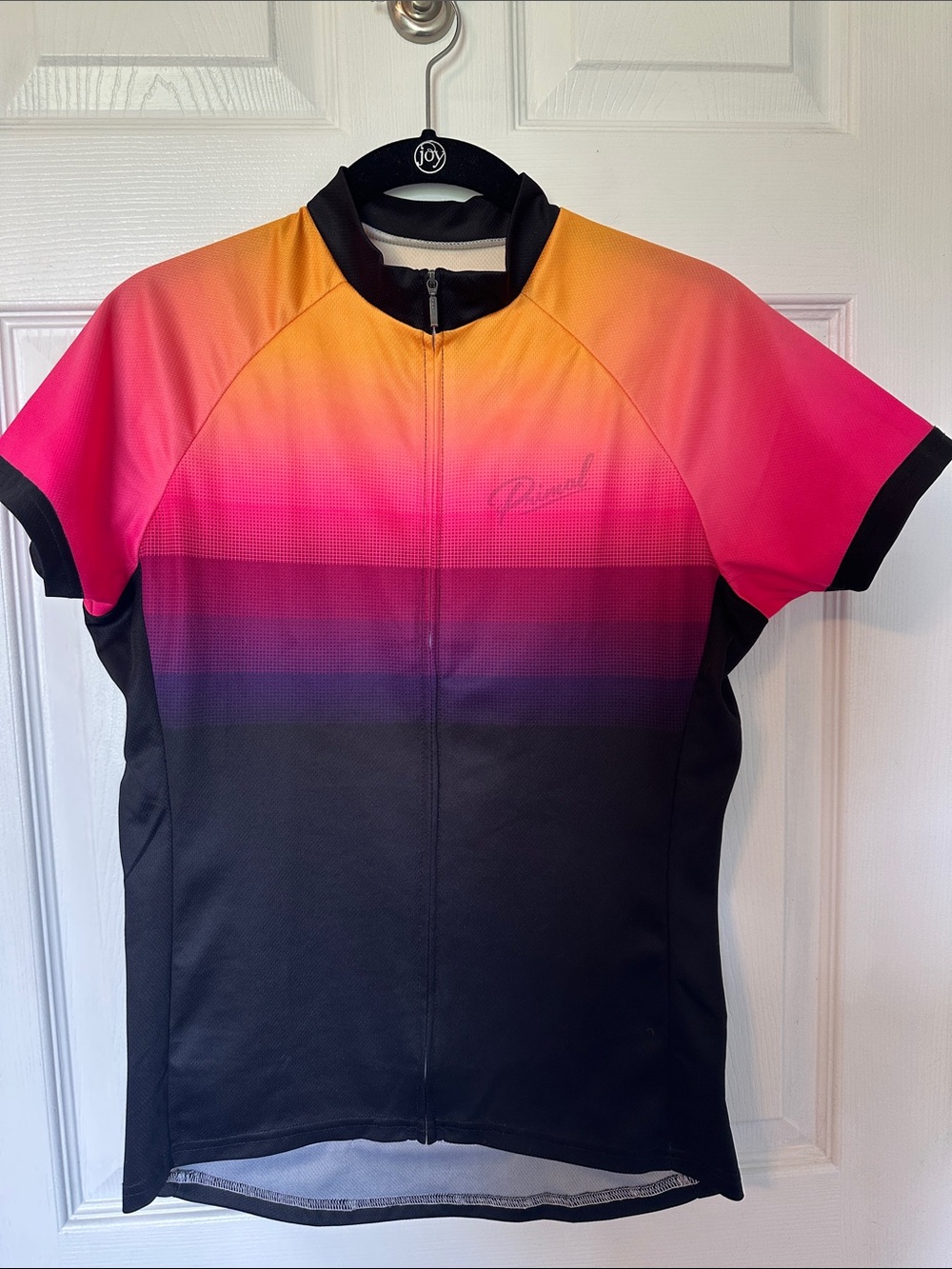 Primal women’s Short-Sleeve Cycling Jersey — Pink, Orange, Black. Size Medium.